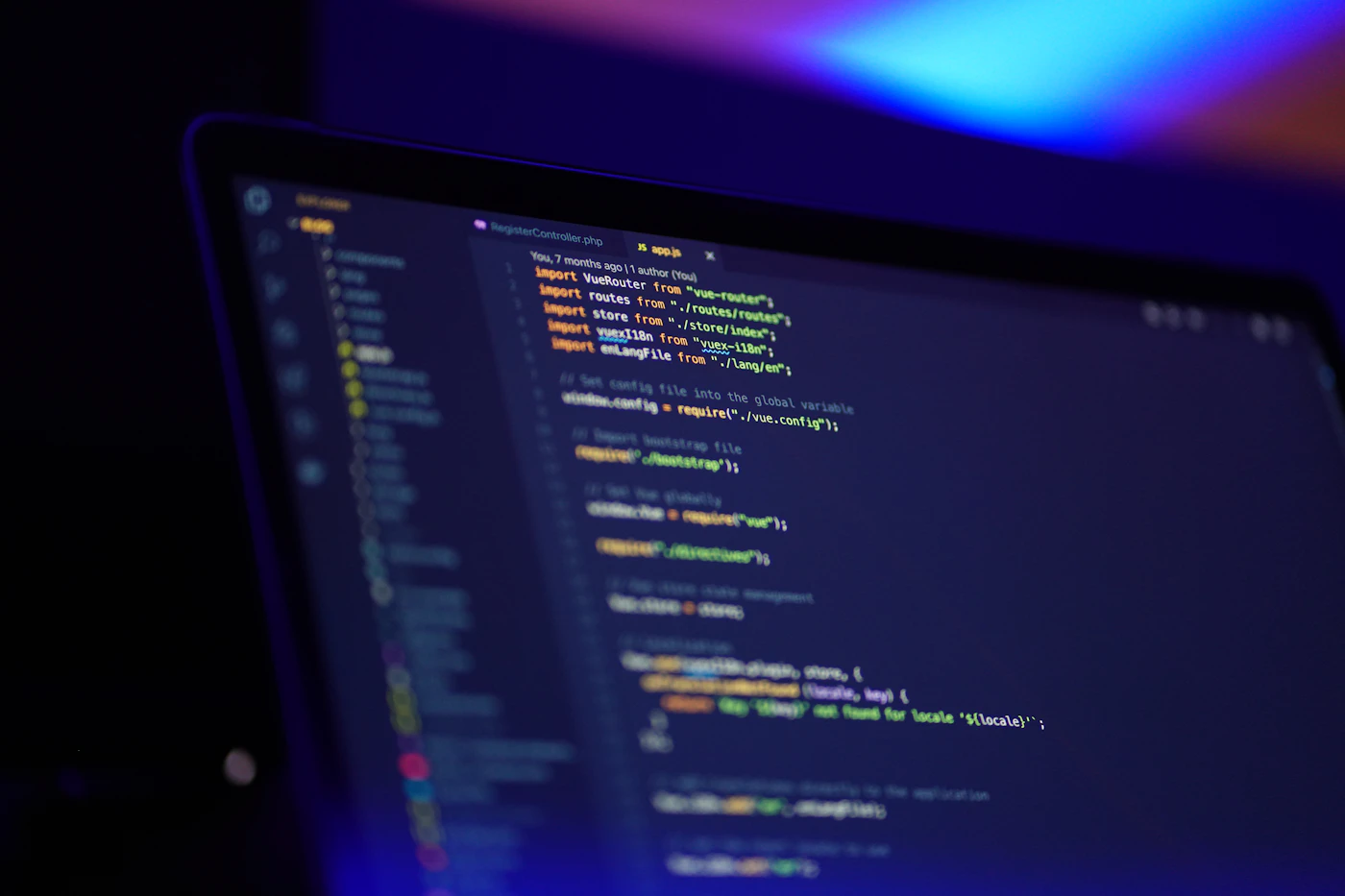 A laptop displaying a code editor